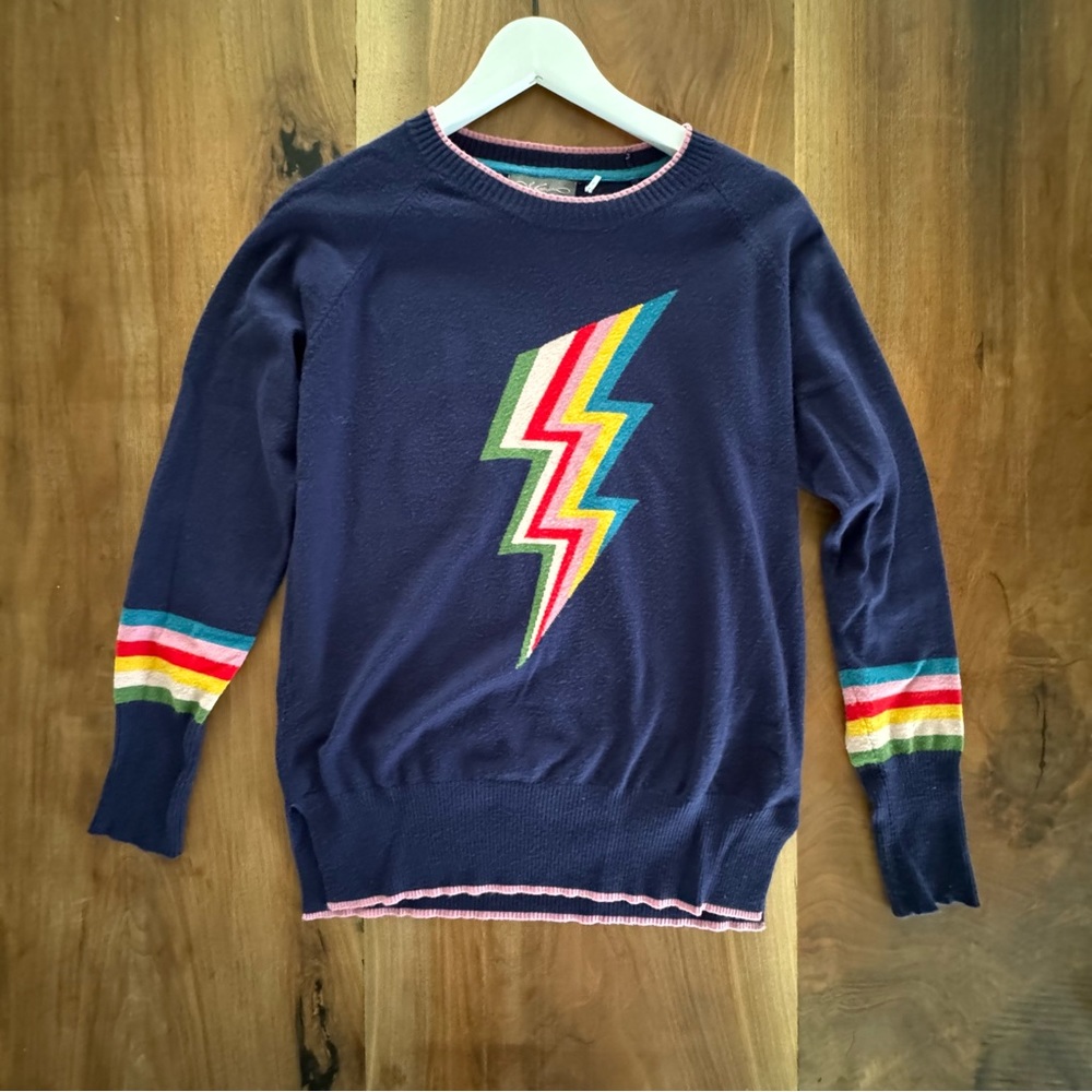 Navy blue lightning bolt sweater with rainbow trim